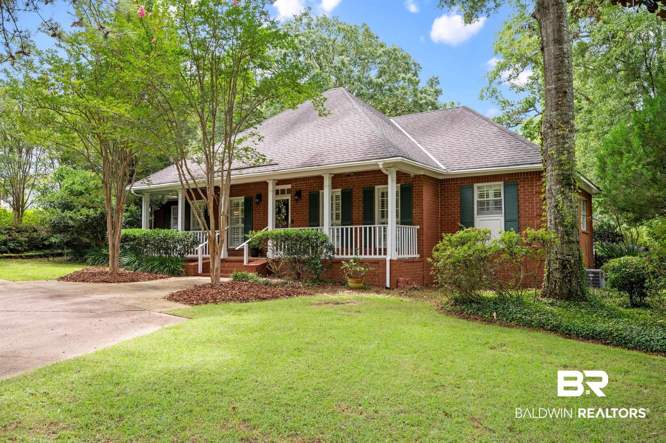 6638 Jackson Square Daphne, AL 36526 - Photo 40 of 62 View of front of house with a porch and a front lawn
