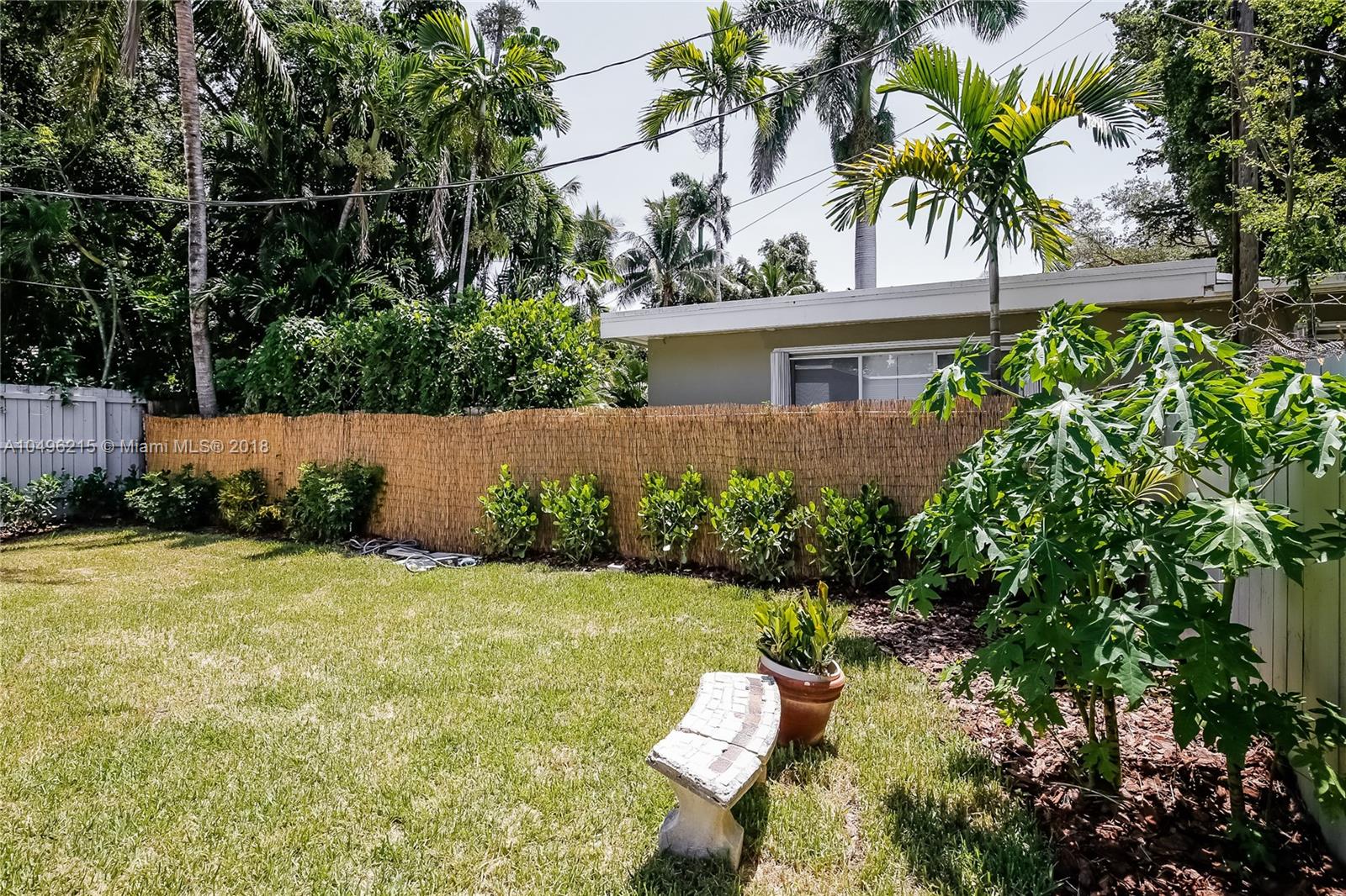 4033 South Le Jeune Road Miami, FL 33146 - Photo 19 of 19 a view of backyard with plants and outdoor seating