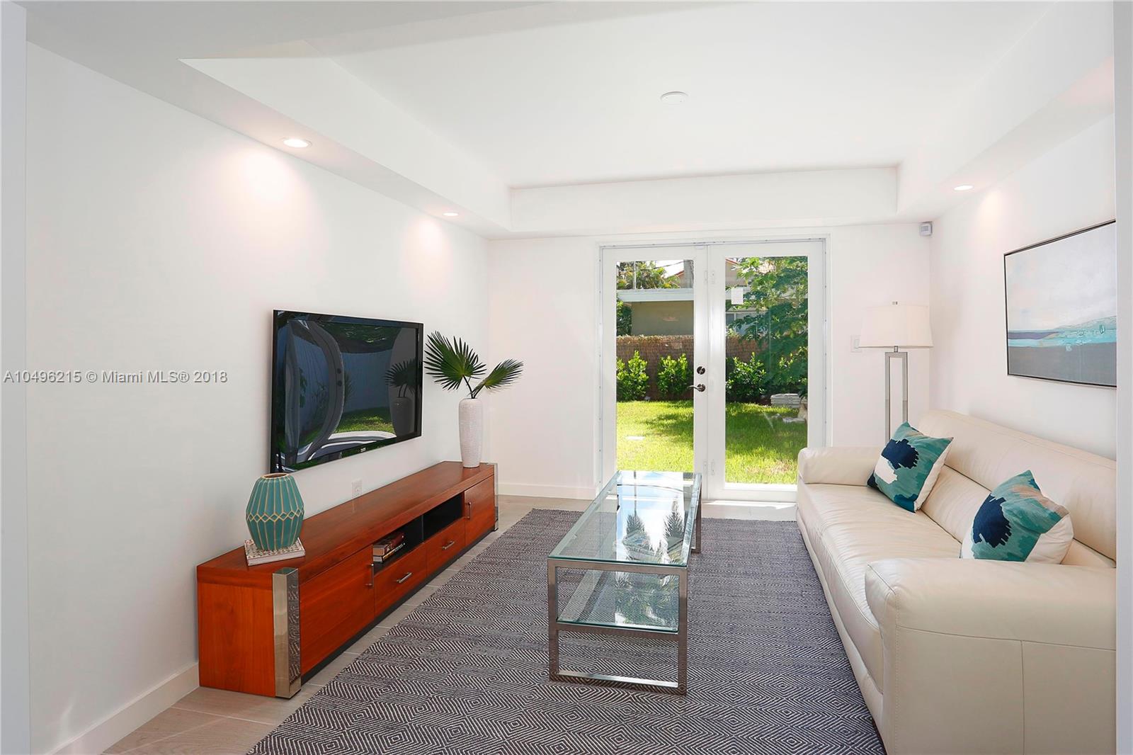 4033 South Le Jeune Road Miami, FL 33146 - Photo 5 of 19 a living room with furniture and a flat screen tv