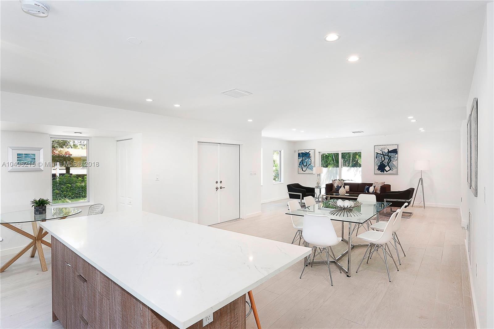 4033 South Le Jeune Road Miami, FL 33146 - Photo 7 of 19 a living room with furniture a window and a table