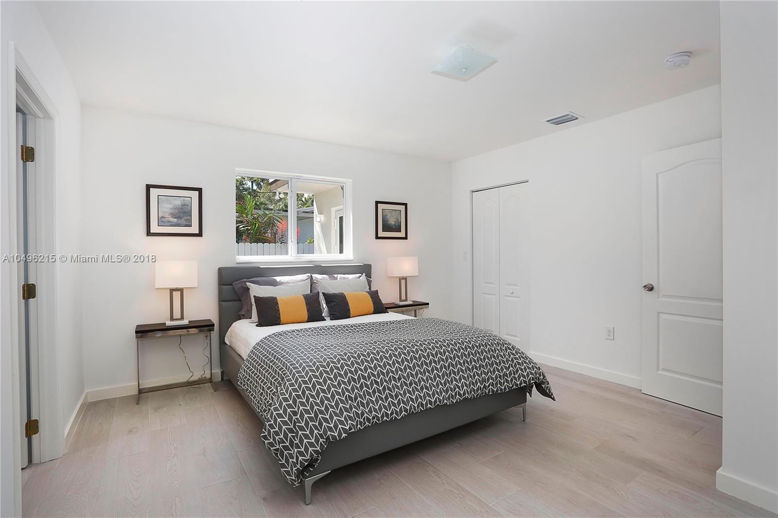 4033 South Le Jeune Road Miami, FL 33146 - Photo 8 of 19 a bedroom with a bed and a window