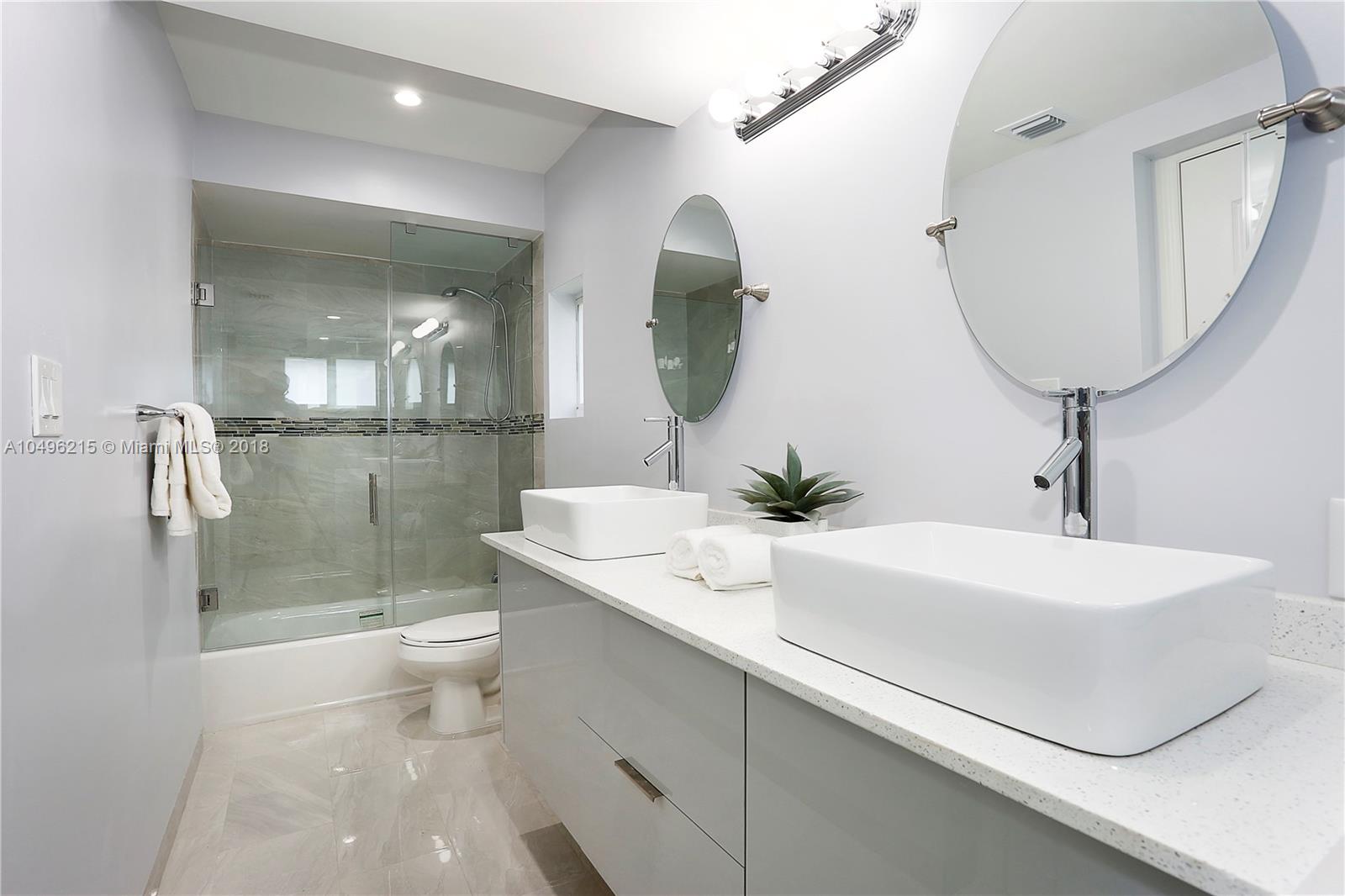 4033 South Le Jeune Road Miami, FL 33146 - Photo 9 of 19 a bathroom with a sink a toilet and shower