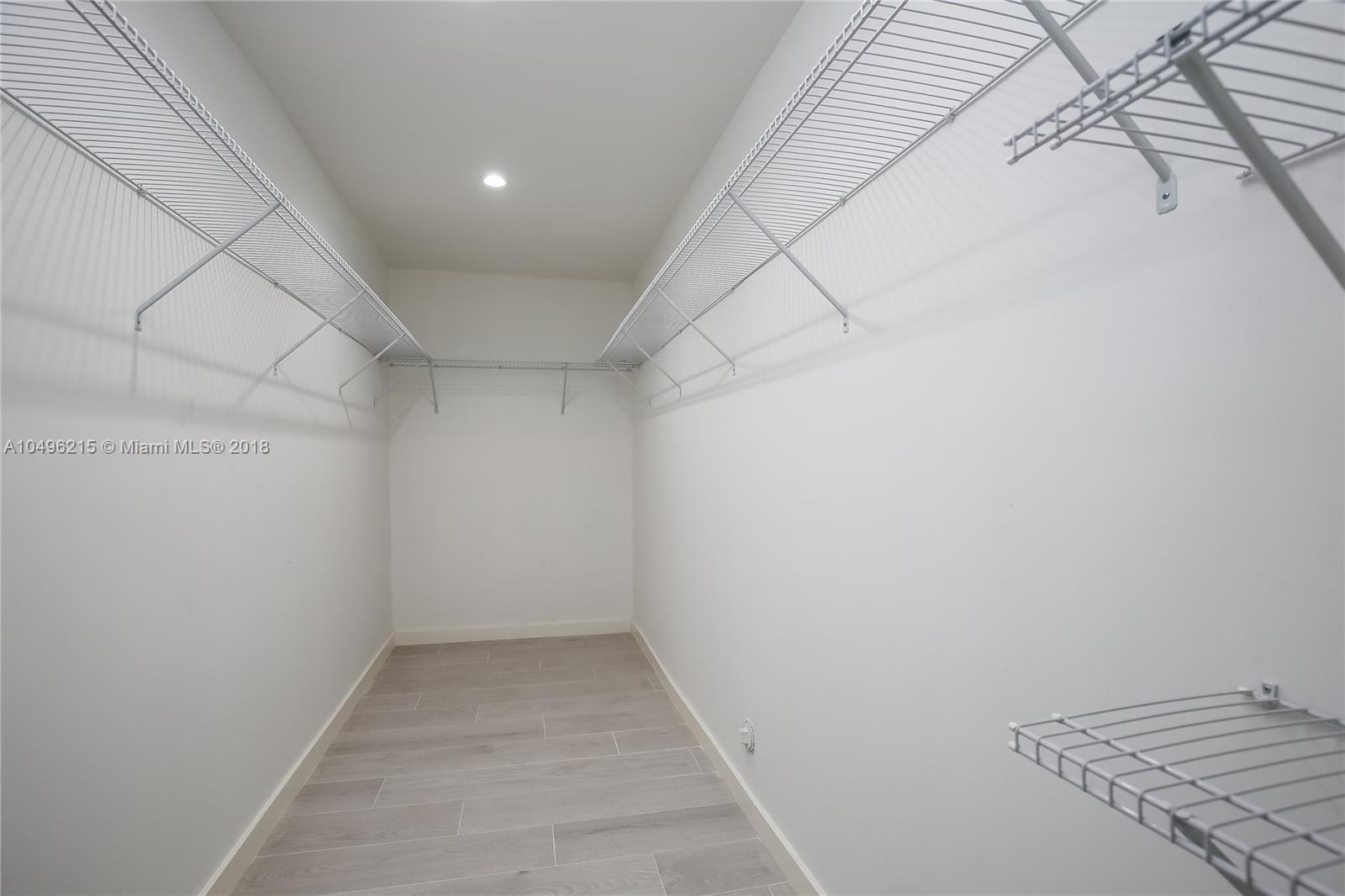 4033 South Le Jeune Road Miami, FL 33146 - Photo 10 of 19 an empty room with a bench