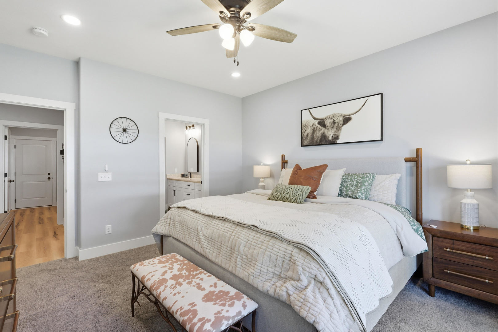6779 Genesis Way Bettendorf, IA 52722 - Photo 19 of 36 a bedroom with a bed and a chandelier