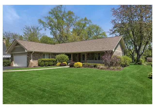 a view of a house with a yard porch and sitting area