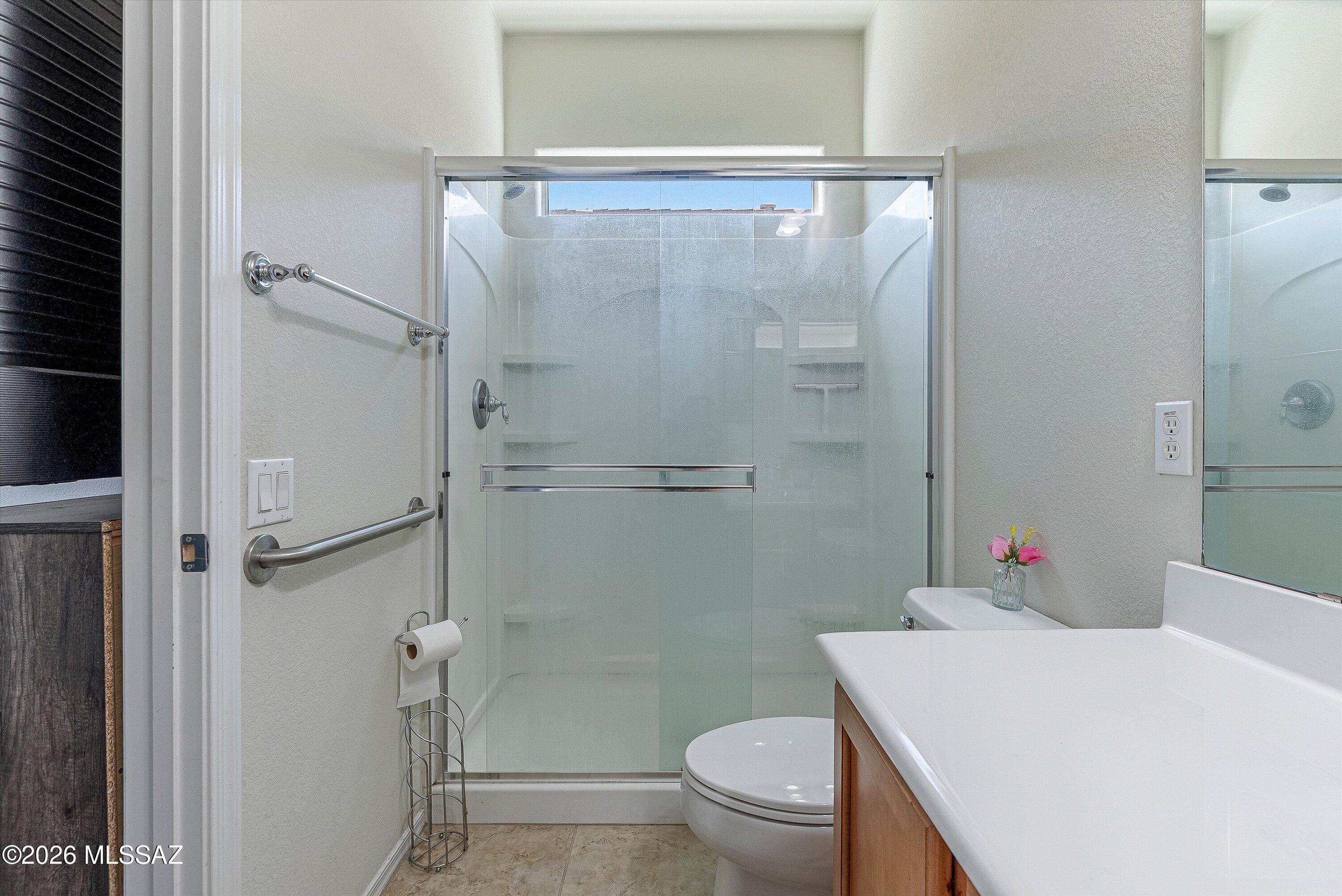 21163 East Treasure Road Red Rock, AZ 85145 - Photo 18 of 35 a bathroom with a sink toilet and shower