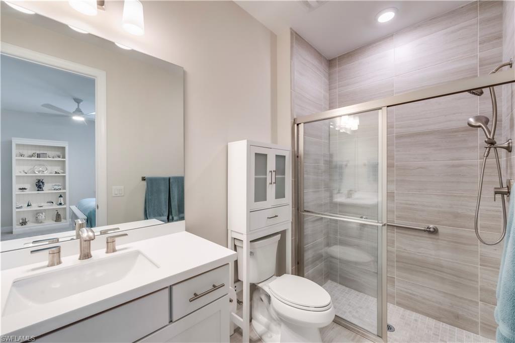 17571 Kinzie Lane Estero, FL 33928 - Photo 26 of 49 Junior Suite Bathroom featuring walk in glass shower with grab bar