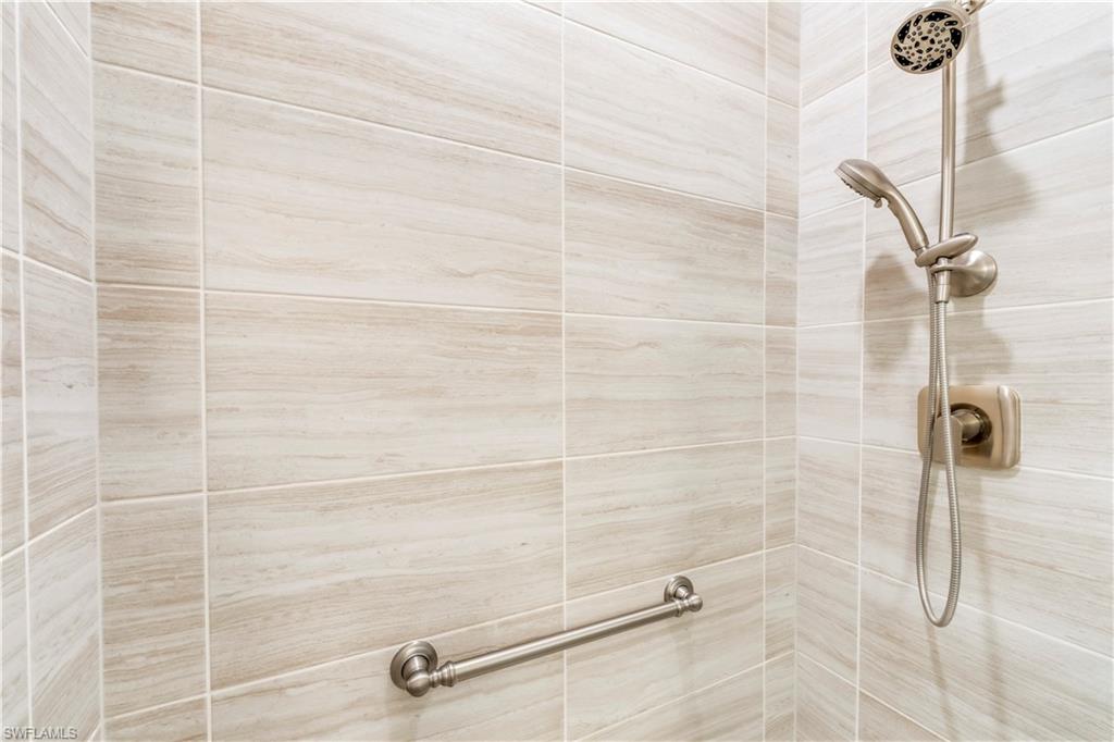 17571 Kinzie Lane Estero, FL 33928 - Photo 27 of 49 Junior Suite Shower with grab bar and upgraded handheld shower fixture.