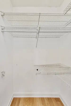 a bathroom with a glass shower door and a glass door