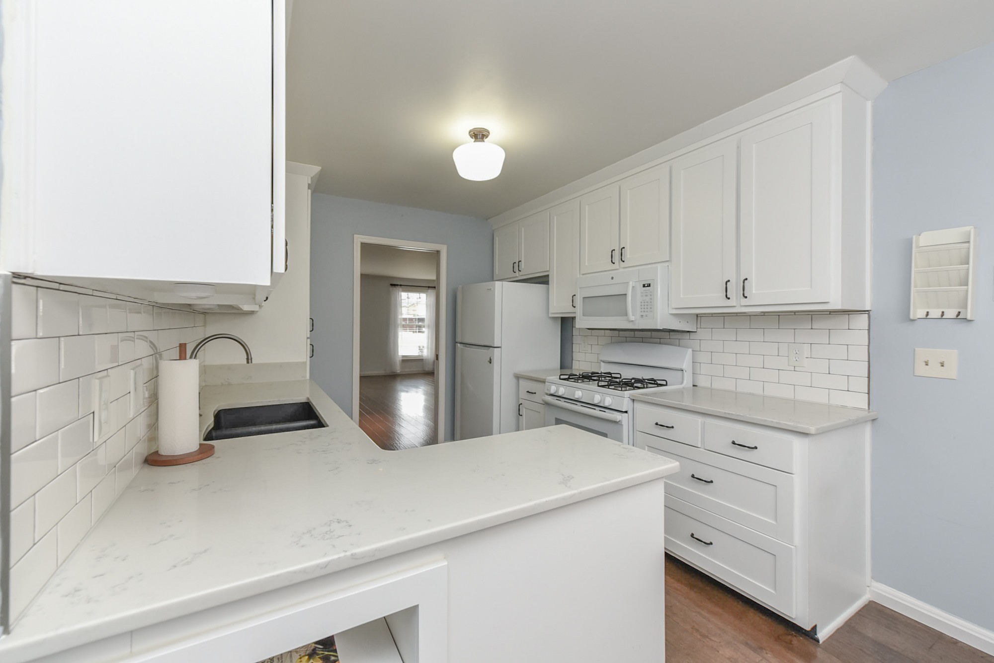 875 General George Patton Road Nashville, TN 37221 - Photo 13 of 42 a kitchen with white cabinets and appliances