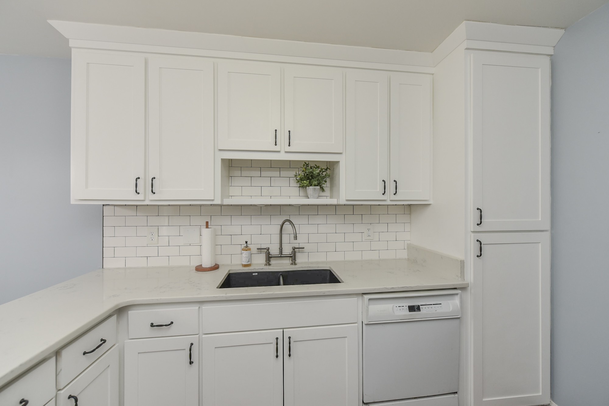 875 General George Patton Road Nashville, TN 37221 - Photo 15 of 42 a kitchen with white cabinets and a sink