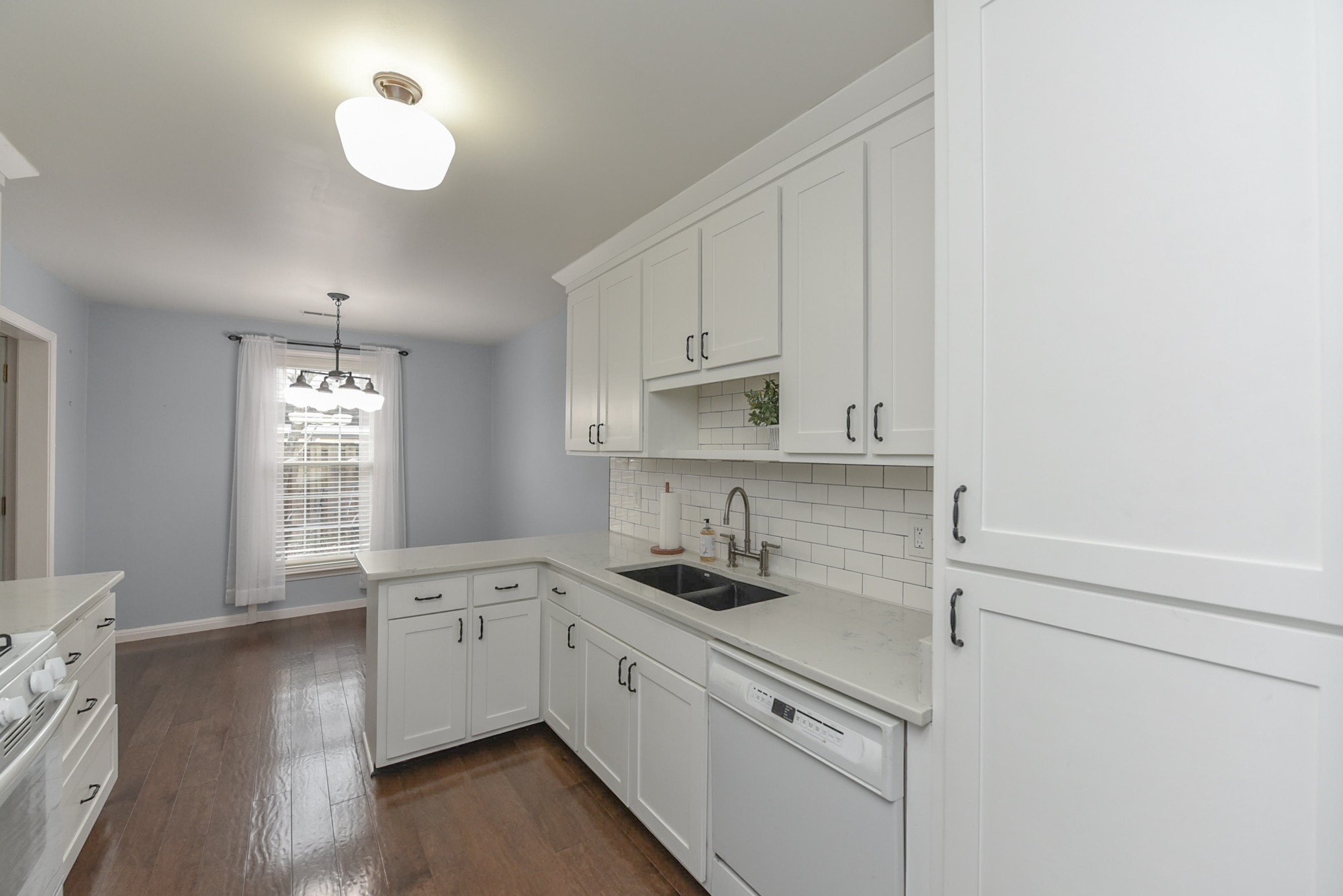 875 General George Patton Road Nashville, TN 37221 - Photo 16 of 42 a kitchen with a sink cabinets and window