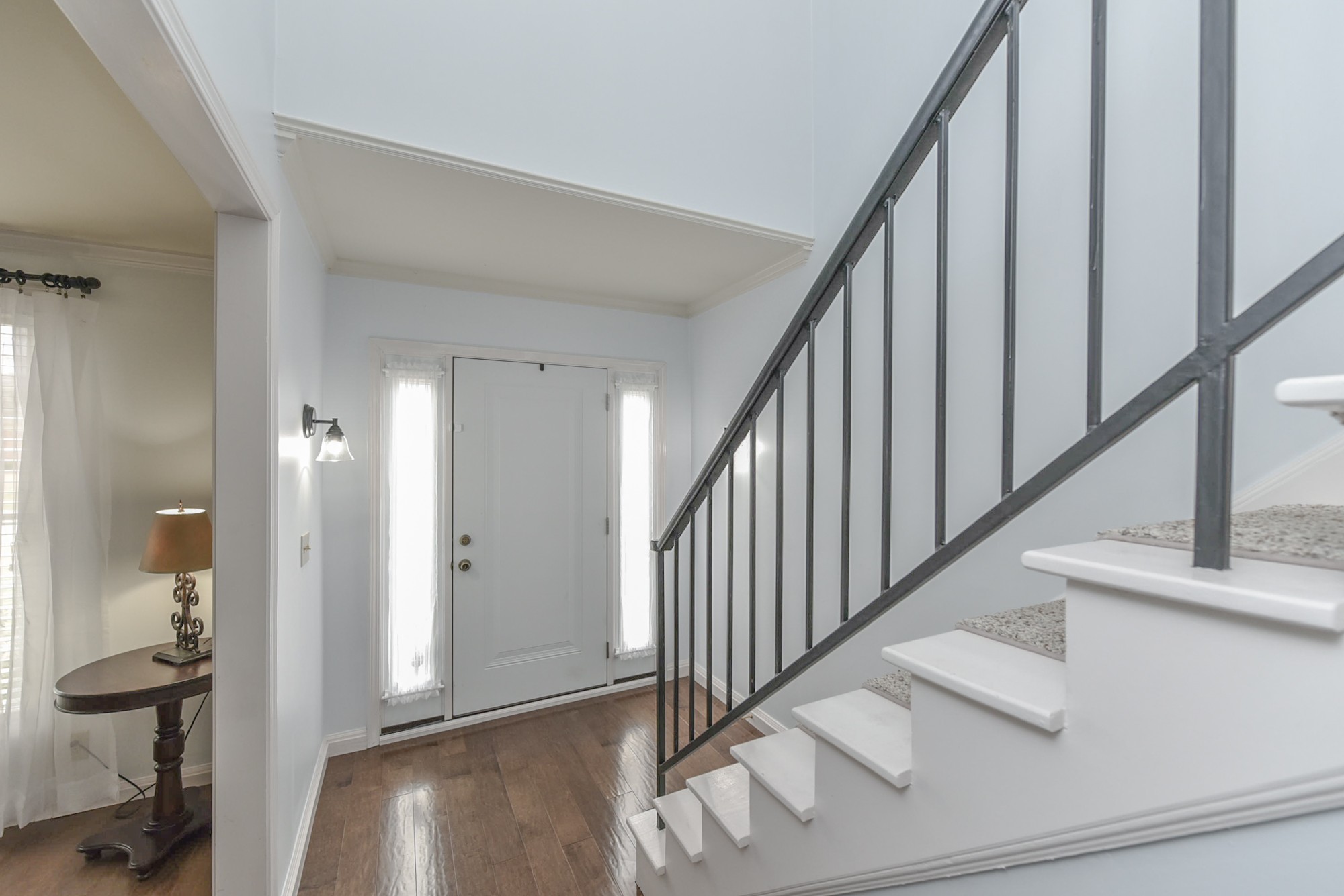 875 General George Patton Road Nashville, TN 37221 - Photo 5 of 42 a view of a hallway with staircase and white walls