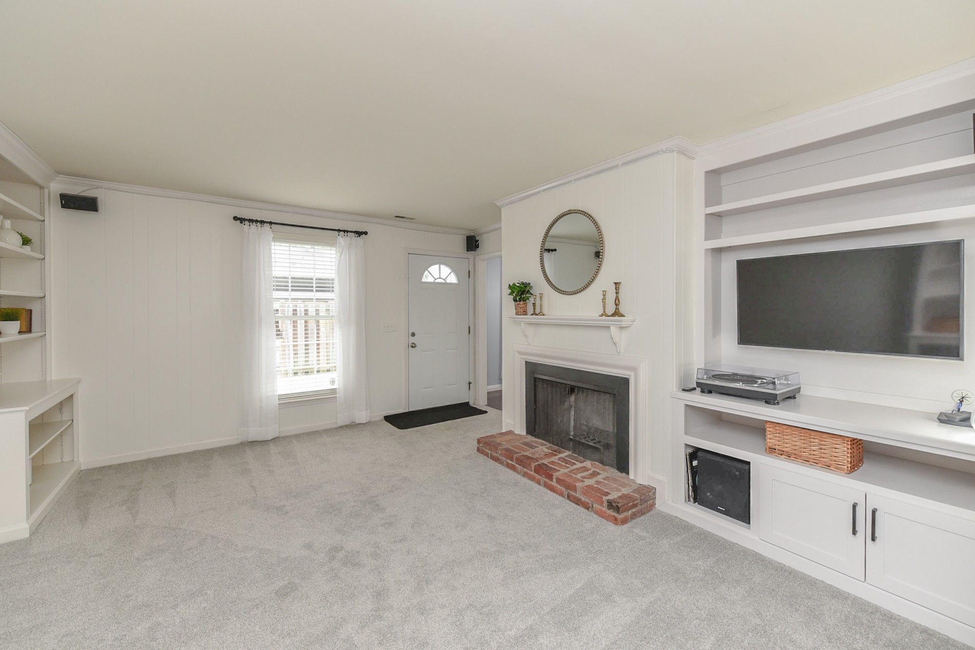 875 General George Patton Road Nashville, TN 37221 - Photo 6 of 42 a living room with furniture a flat screen tv and a fireplace
