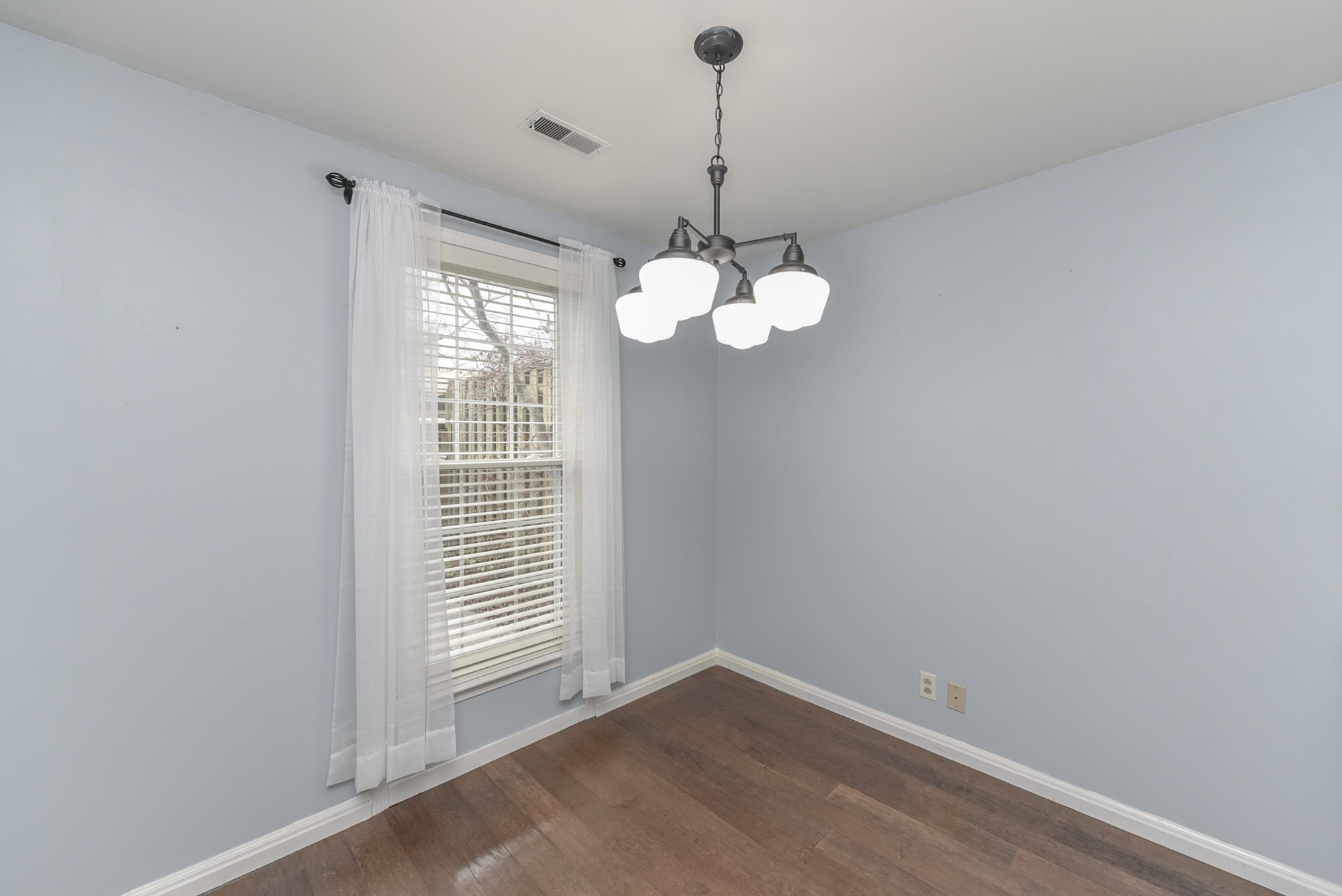 875 General George Patton Road Nashville, TN 37221 - Photo 10 of 42 a view of an empty room with chandelier and a window
