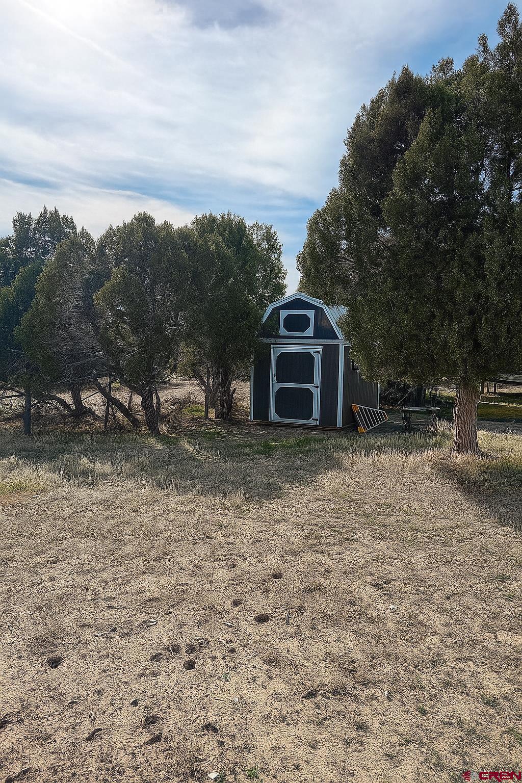 21769 Rd V Lewis, CO 81327 - Photo 9 of 15 a view of a house with a yard