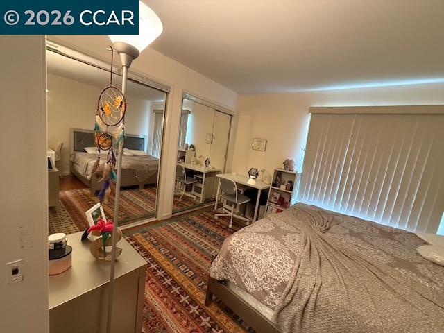 825 Oak Grove Road, Unit 17 Concord, CA 94518 - Photo 17 of 17 a bedroom with furniture and a chandelier