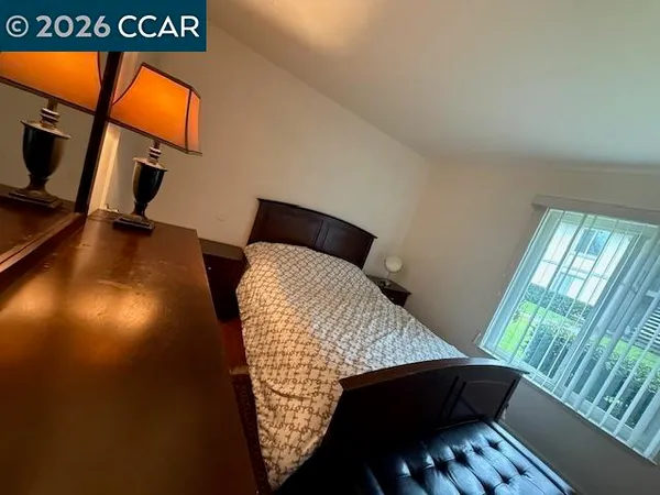 a kitchen with a table chairs and a refrigerator