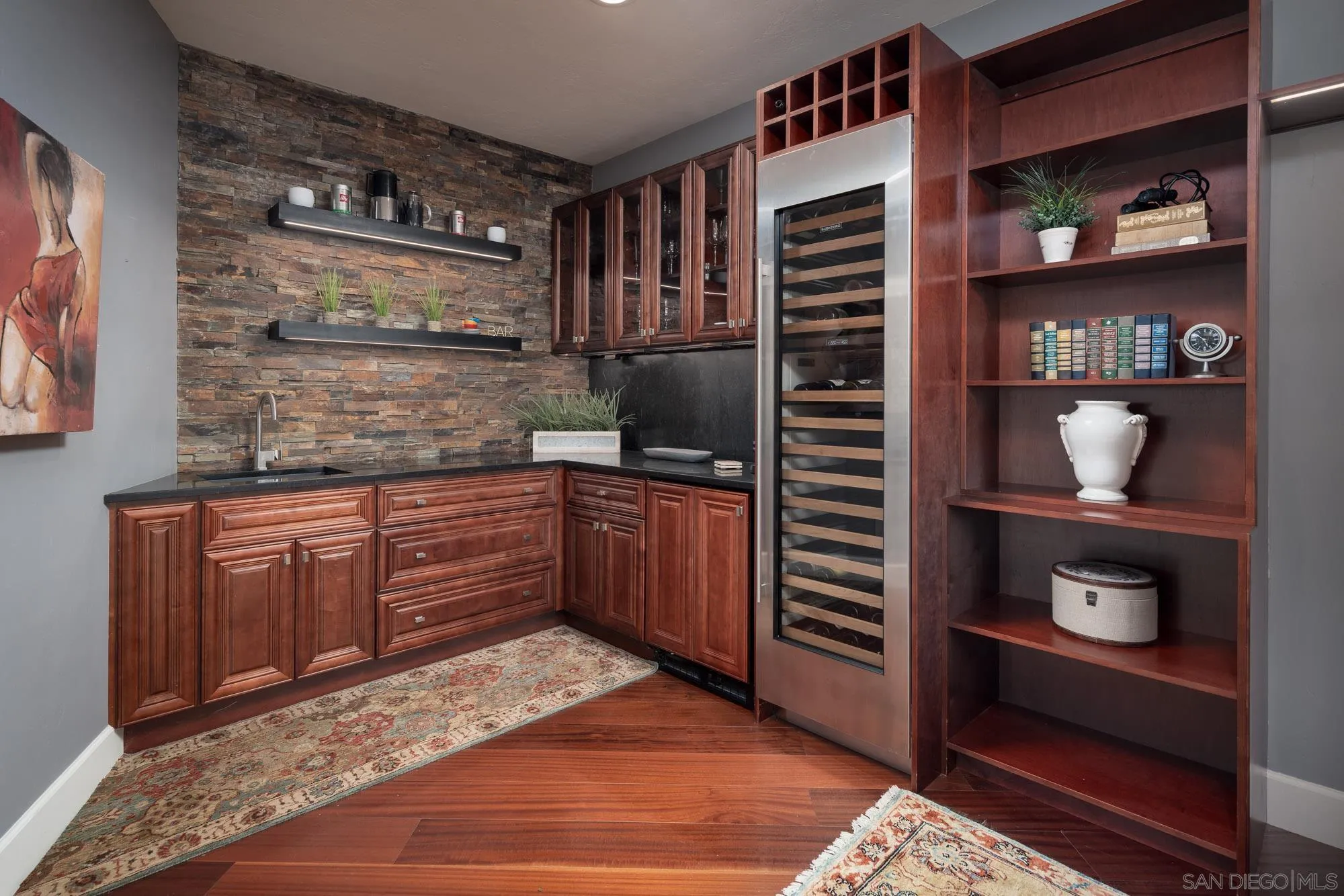 13384 Fallen Leaf Road Poway, CA 92064 - Photo 14 of 27 a kitchen with stainless steel appliances granite countertop a refrigerator and wooden cabinets