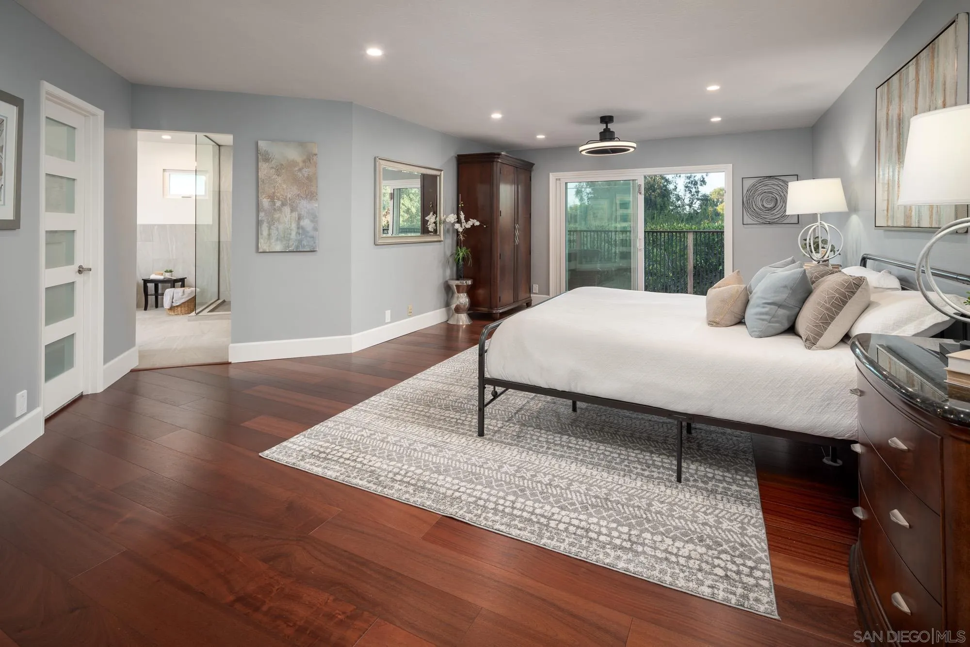 13384 Fallen Leaf Road Poway, CA 92064 - Photo 15 of 27 a bedroom with a bed window and wooden floor