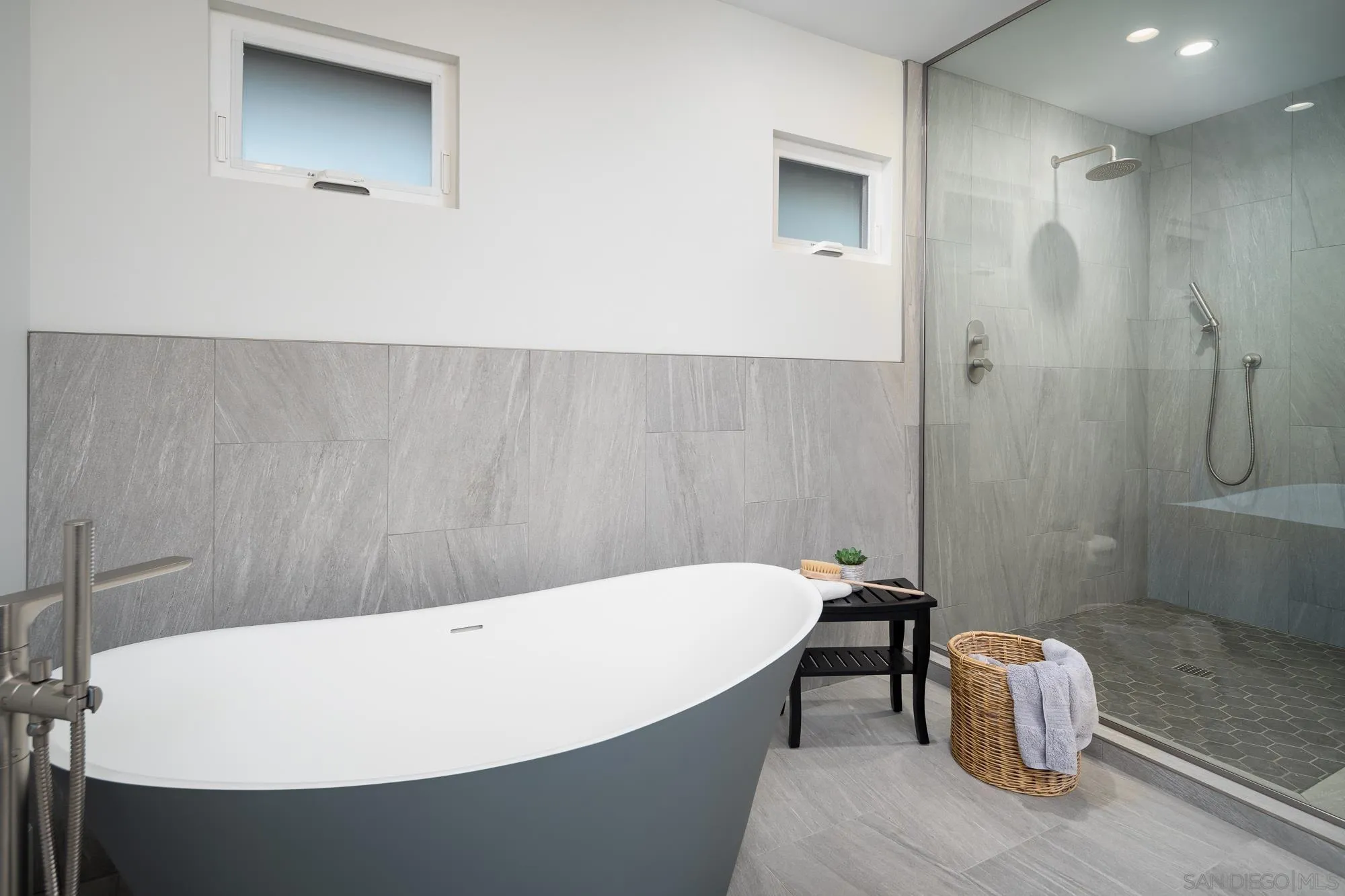 13384 Fallen Leaf Road Poway, CA 92064 - Photo 17 of 27 a white bath tub sitting in a bathroom