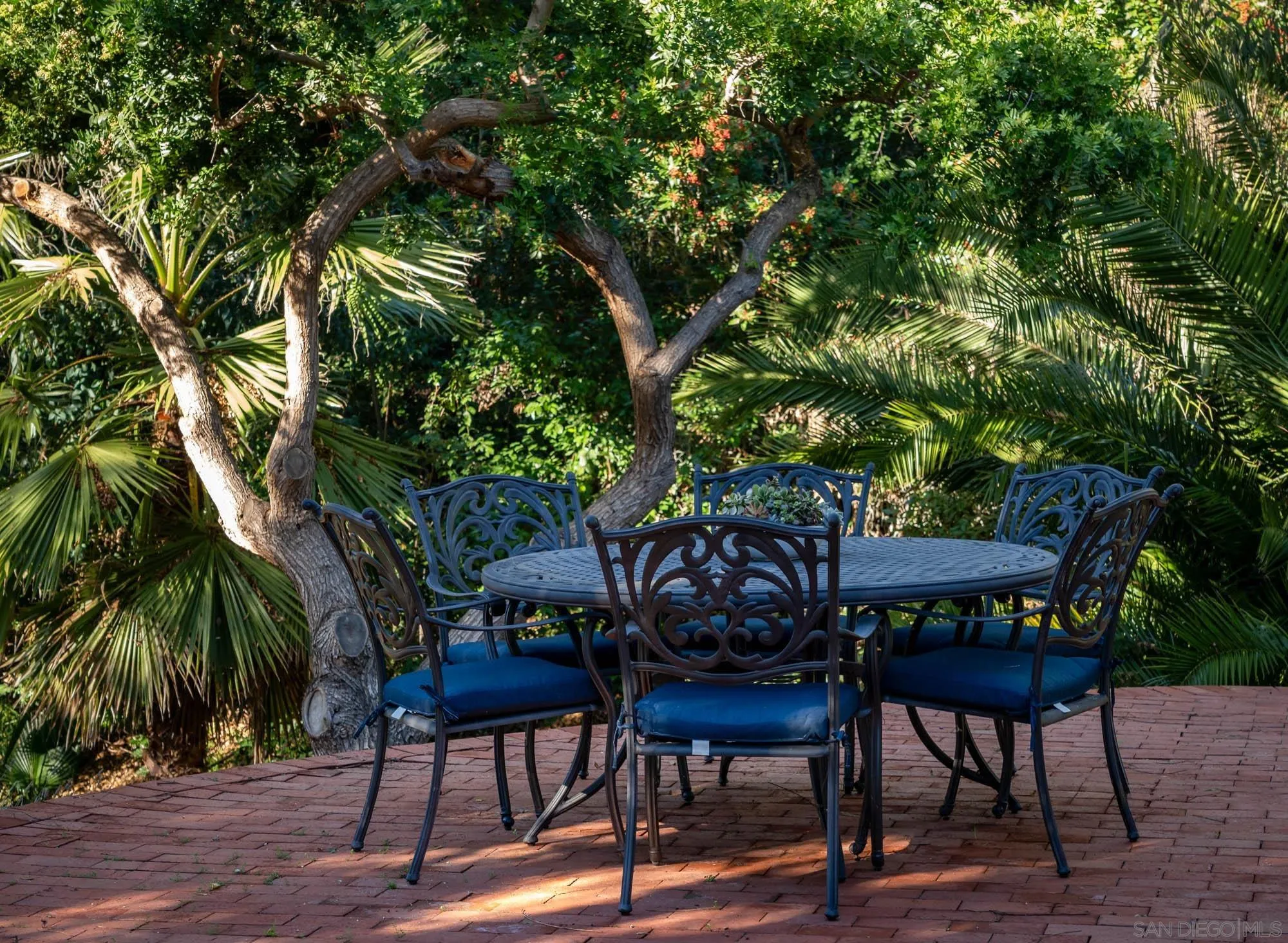 13384 Fallen Leaf Road Poway, CA 92064 - Photo 25 of 27 a backyard of a house with barbeque oven table and chairs