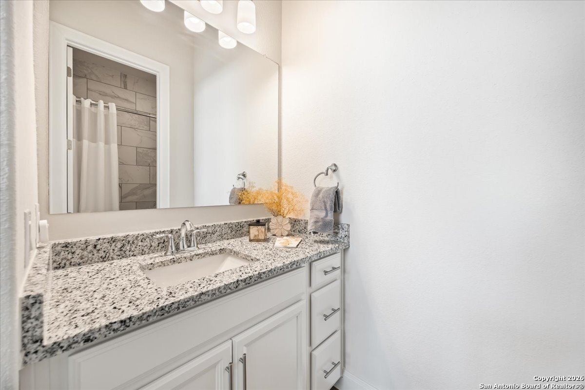 419 Heidelberg Road New Braunfels, TX 78132 - Photo 11 of 62 a bathroom with a sink and a mirror