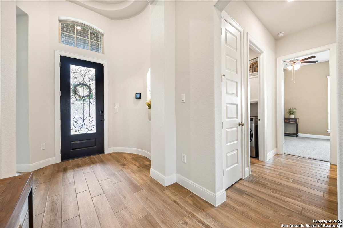 419 Heidelberg Road New Braunfels, TX 78132 - Photo 14 of 62 a view of a hallway view with wooden floor and staircase
