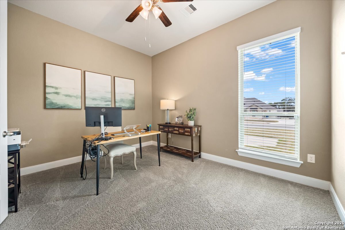 419 Heidelberg Road New Braunfels, TX 78132 - Photo 15 of 62 a view of a workspace with furniture and a window