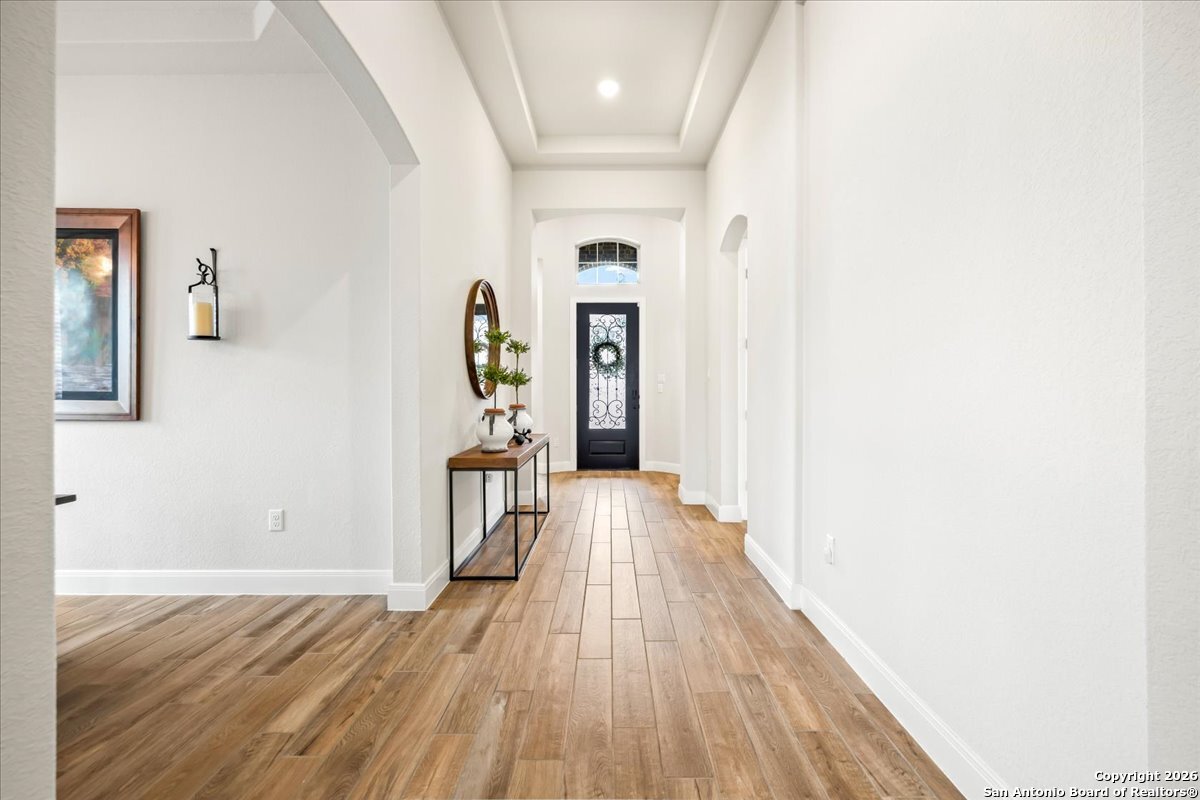419 Heidelberg Road New Braunfels, TX 78132 - Photo 18 of 62 a view of a hallway with wooden floor