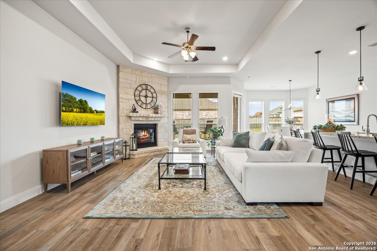 419 Heidelberg Road New Braunfels, TX 78132 - Photo 19 of 62 a living room with furniture and a fireplace