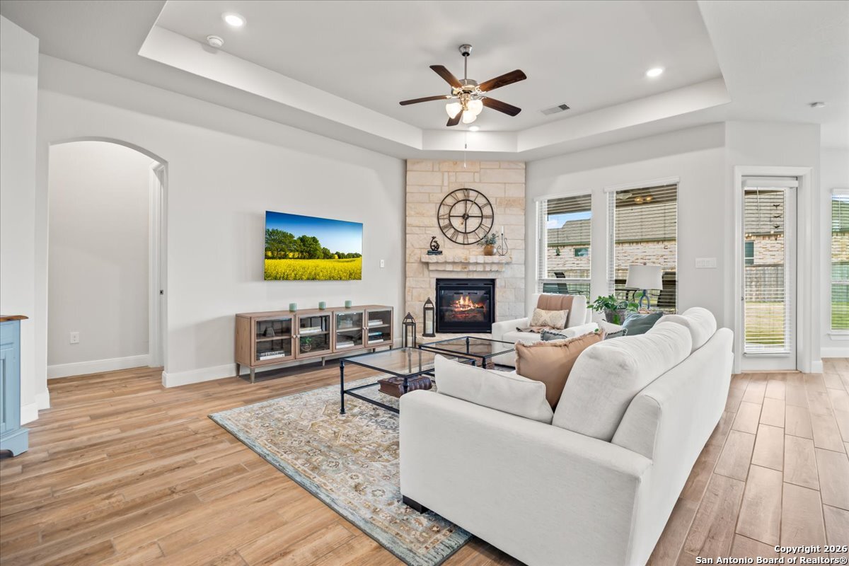 419 Heidelberg Road New Braunfels, TX 78132 - Photo 20 of 62 a living room with furniture and a fireplace