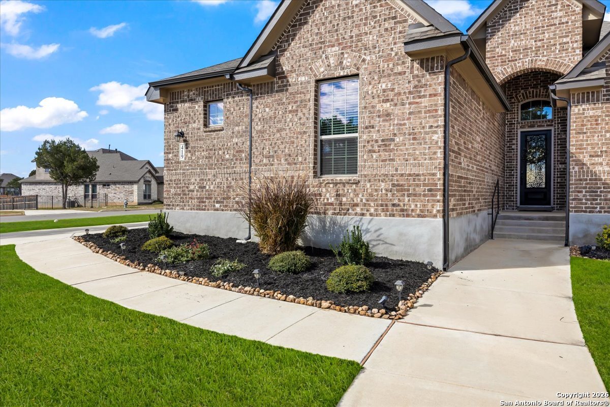419 Heidelberg Road New Braunfels, TX 78132 - Photo 2 of 62 a front view of a house with garden