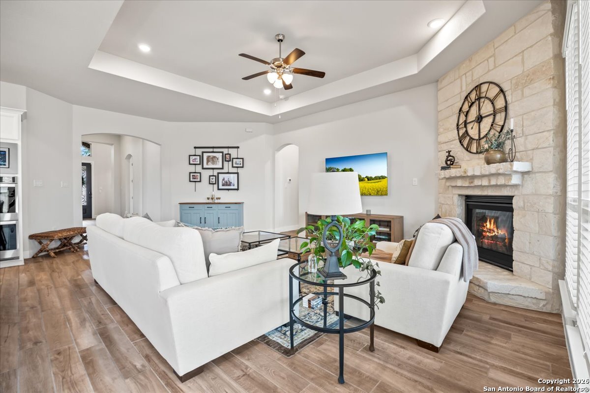 419 Heidelberg Road New Braunfels, TX 78132 - Photo 21 of 62 a living room with furniture and a fireplace