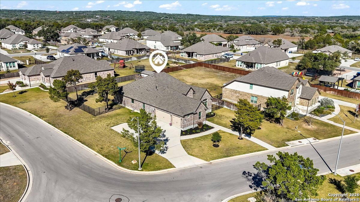 419 Heidelberg Road New Braunfels, TX 78132 - Photo 47 of 62 an aerial view of a house with a swimming pool and mountains