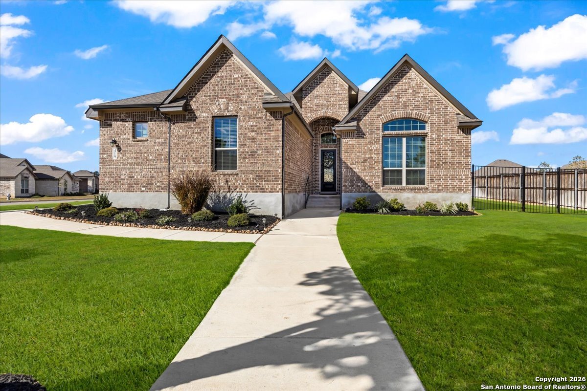 419 Heidelberg Road New Braunfels, TX 78132 - Photo 6 of 62 a front view of a house with a yard and garage