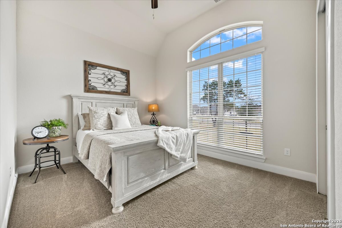 419 Heidelberg Road New Braunfels, TX 78132 - Photo 10 of 62 a bedroom with a bed and a window