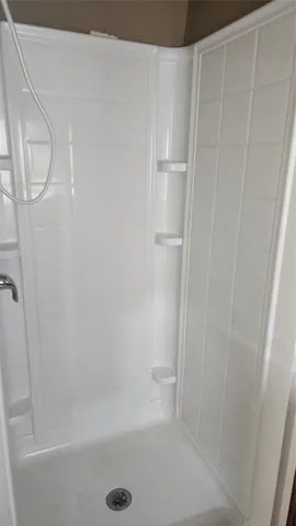 a view of a hallway with seating area