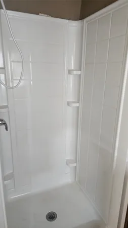 a view of a hallway with seating area