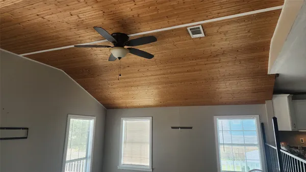 a kitchen with a refrigerator a stove a microwave and cabinets