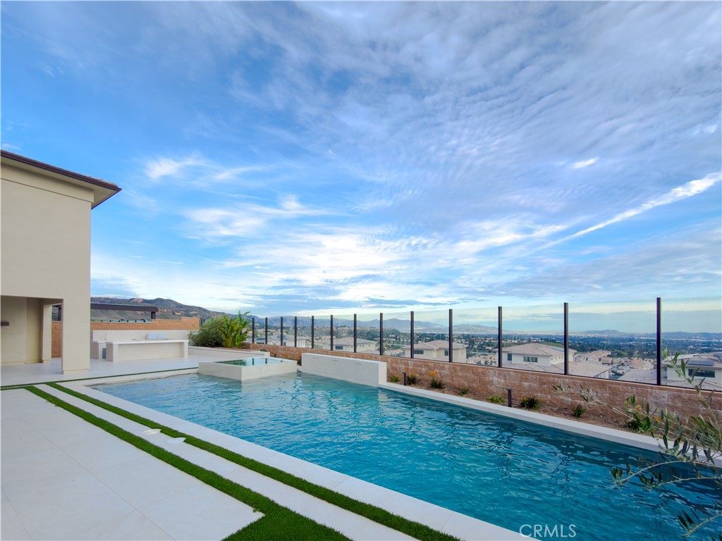 a view of swimming pool with a yard