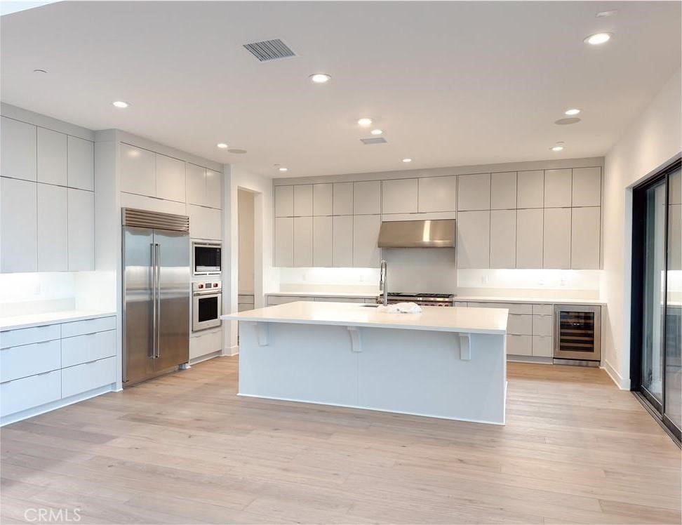 20138 Marlow Lane Porter Ranch, CA 91326 - Photo 11 of 32 a kitchen with granite countertop a sink stainless steel appliances and cabinets