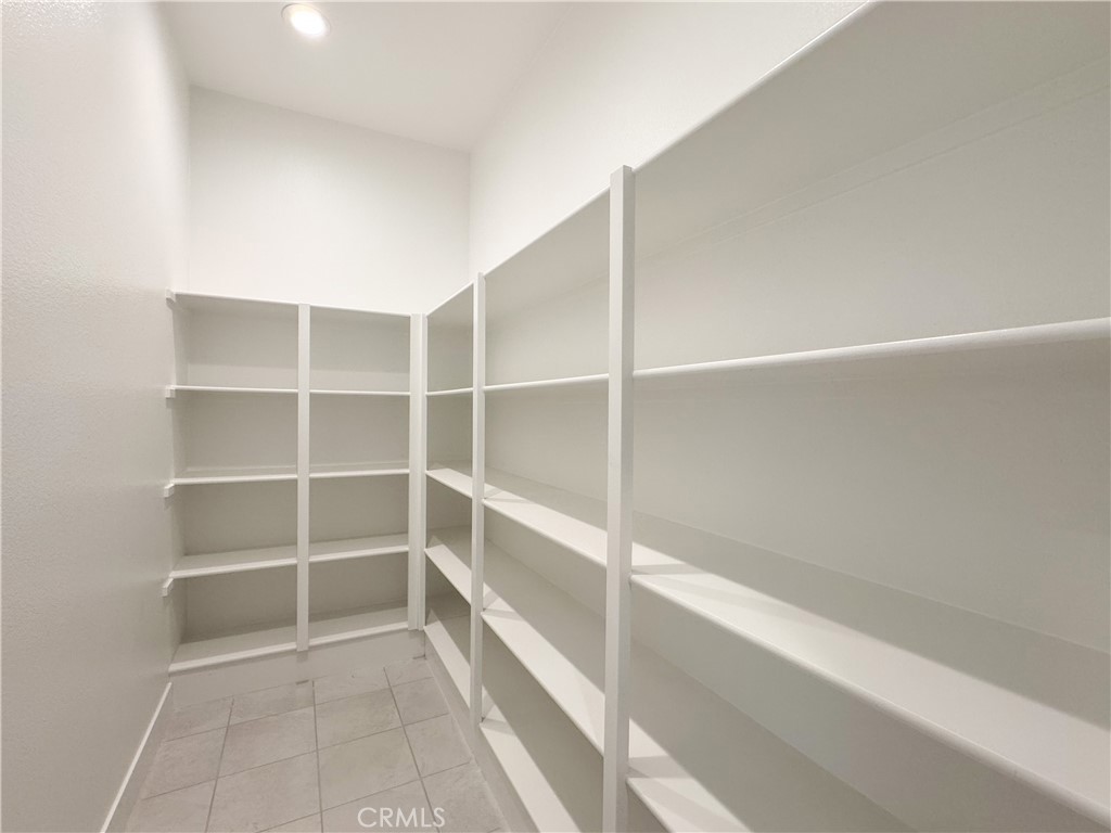 20138 Marlow Lane Porter Ranch, CA 91326 - Photo 13 of 32 a view of an empty walk in closet