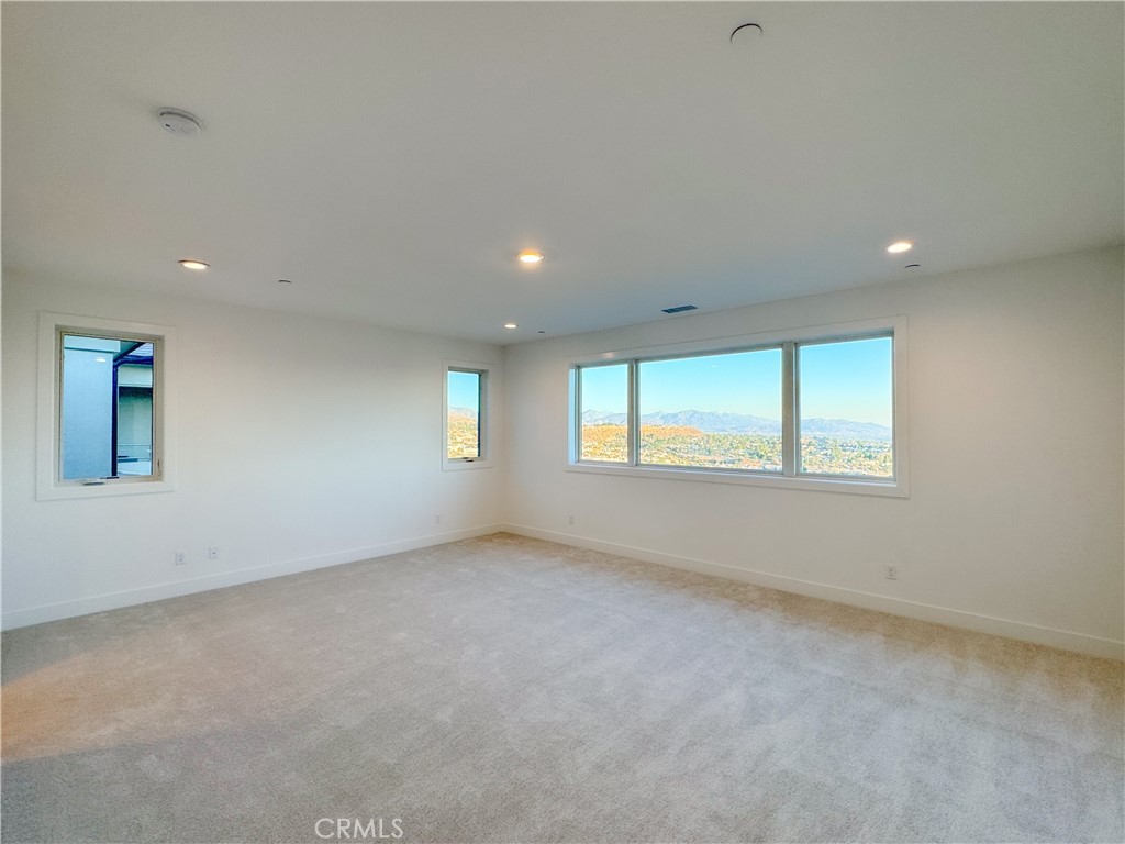 20138 Marlow Lane Porter Ranch, CA 91326 - Photo 19 of 32 an empty room with windows