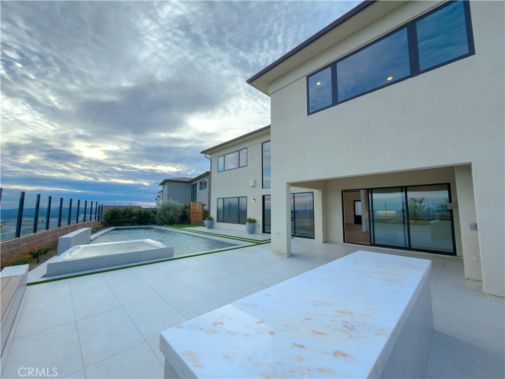 20138 Marlow Lane Porter Ranch, CA 91326 - Photo 19 of 36 a view of a house with a backyard