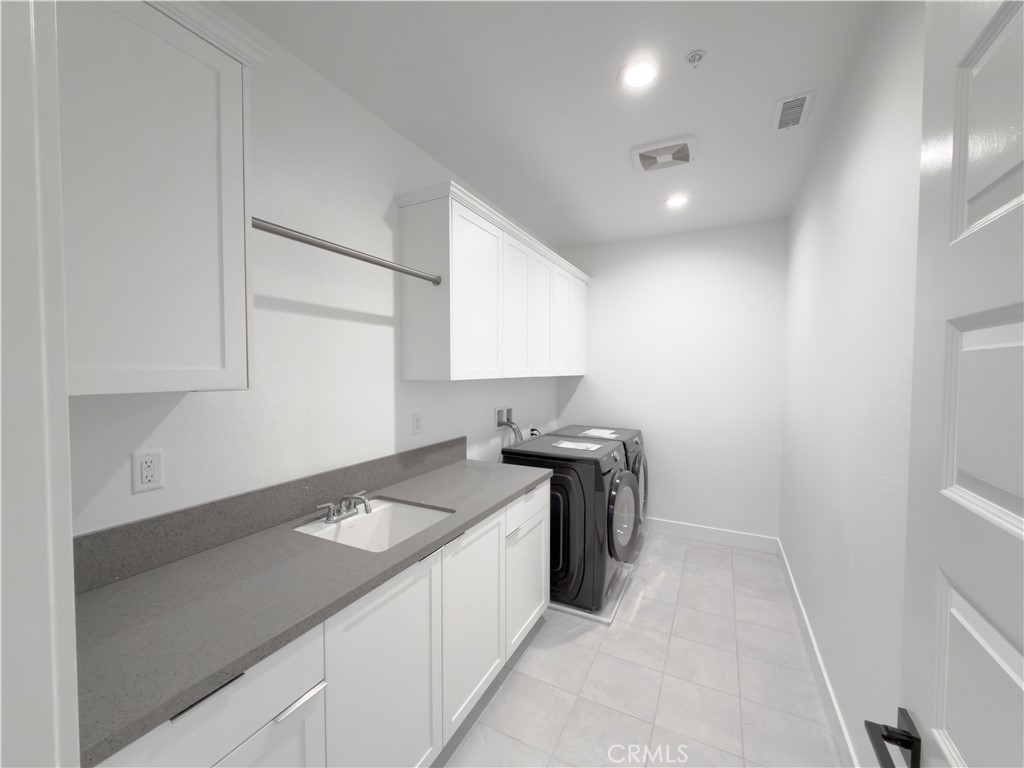 20138 Marlow Lane Porter Ranch, CA 91326 - Photo 20 of 36 a kitchen that has a sink and a stove in it