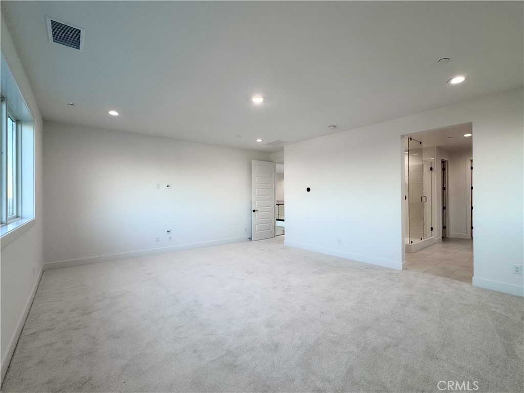 20138 Marlow Lane Porter Ranch, CA 91326 - Photo 20 of 32 an empty room with window and pillar in it