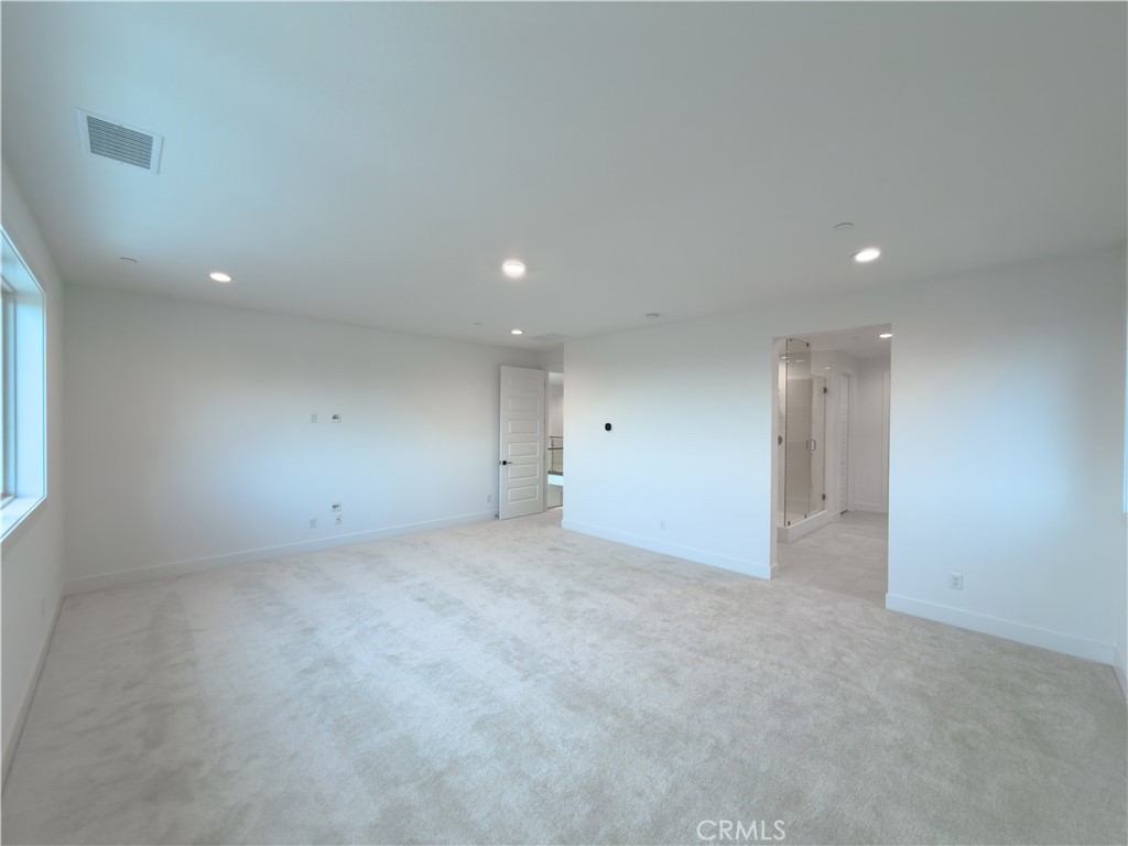 20138 Marlow Lane Porter Ranch, CA 91326 - Photo 22 of 36 an empty room with an entryway and fan