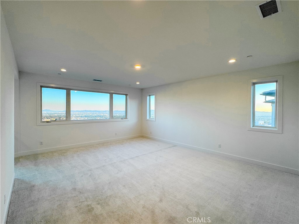 20138 Marlow Lane Porter Ranch, CA 91326 - Photo 24 of 32 an empty room with windows and closet