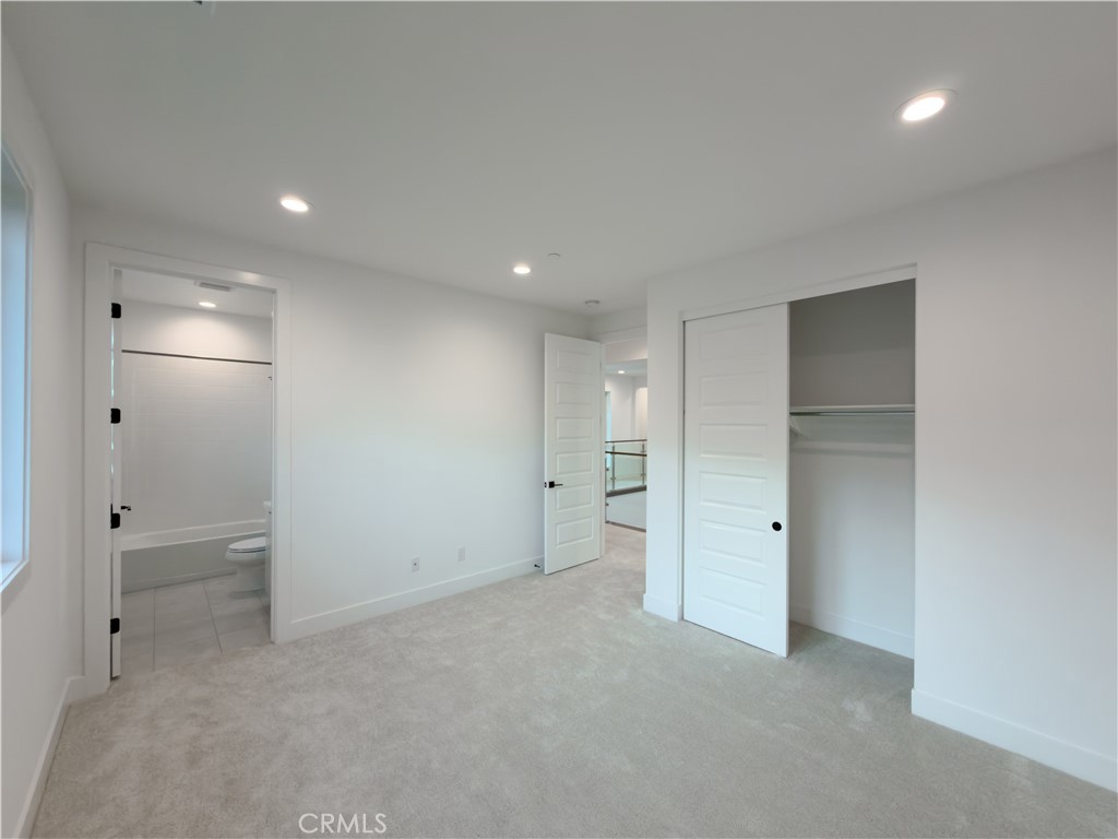 20138 Marlow Lane Porter Ranch, CA 91326 - Photo 29 of 36 an empty room with closet and a bathroom